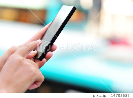 woman hands use smart phone in modern city  14702682