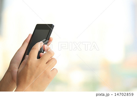 woman hands use smart phone in modern city 14702859