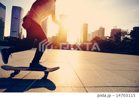 woman skateboarder legs skateboarding at sunrise c woman skateboarder legs skateboarding at sunrise c 14703115