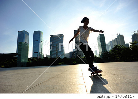 woman skateboarder legs skateboarding at sunrise c woman skateboarder legs skateboarding at sunrise c 14703117