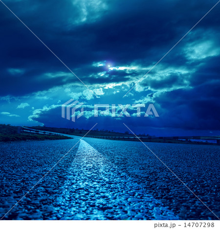 low dramatic clouds over asphalt road in moonlight low dramatic clouds over asphalt road in moonlight 14707298