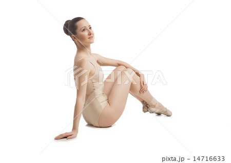 young pretty ballet dancer sitting in elegant pose. back view young pretty ballet dancer sitting in elegant pose. back view 14716633