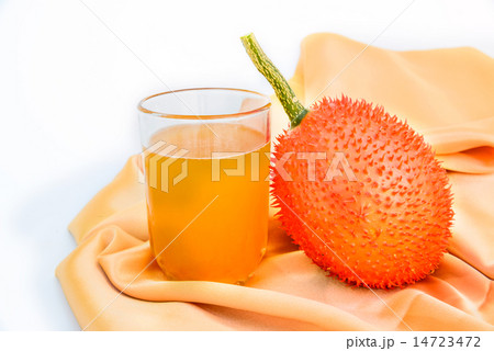 Gac fruit and juice isolated on white. Gac fruit and juice isolated on white. 14723472