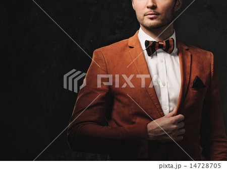 Sharp dressed fashionist wearing jacket and bow tie Sharp dressed fashionist wearing jacket and bow tie 14728705