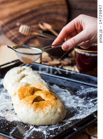 Butter raw dough sprinkled with cinnamon 14729847