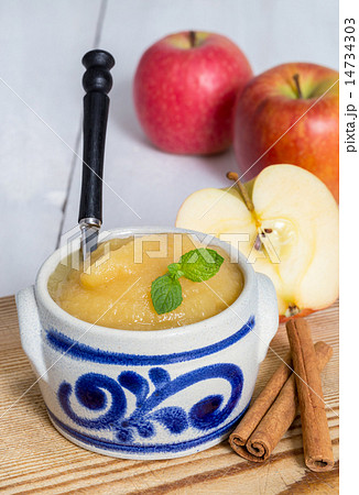 Applesauce with cinnamon in stoneware bowl 14734303