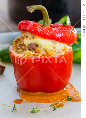 Baked stuffed peppers with meat sauce and cheese 14734312