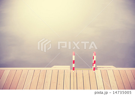 Retro vintage filtered wooden pier and ladder. 14735005