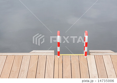 Wooden pier and ladder by the water. 14735006