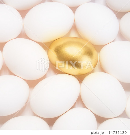 gold Easter egg between many white eggs 14735120