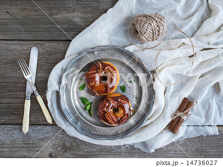 Cinnamon donuts with caramel icing Cinnamon donuts with caramel icing 14736027