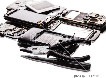broken phones and pliers closeup 14740560