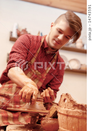 Man making a clay jar Man making a clay jar 14743591