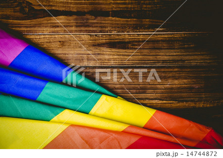 Gay pride flag on wooden table 14744872