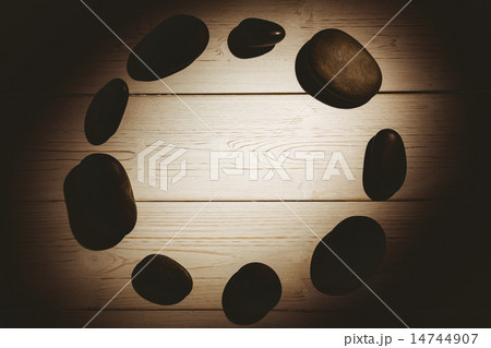 Pebbles laid out on table 14744907