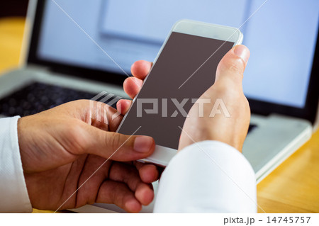 Man using laptop and smartphone 14745757