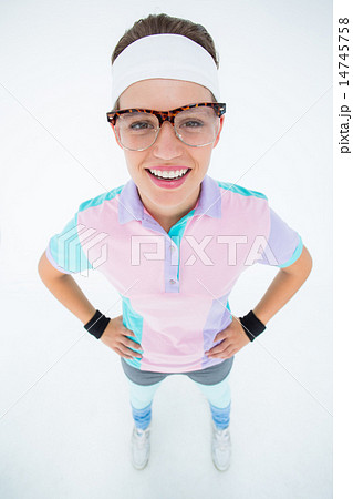 Smiling geeky hipster looking at camera hands on hips 14745758