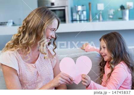 Happy mother and daughter on the couch 14745837