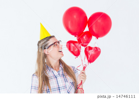 Geeky hipster holding red balloons 14746111