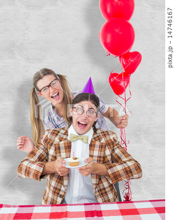 Composite image of geeky hipsters celebrating birthday 14746167
