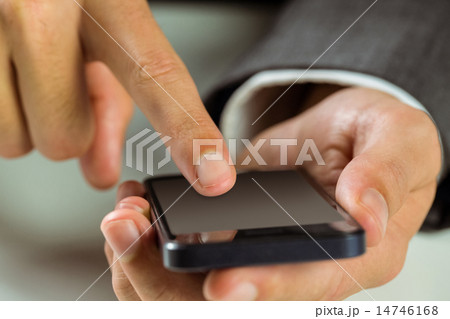 Businessman using his smart phone 14746168