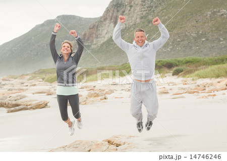 Fit couple smiling at camera 14746246