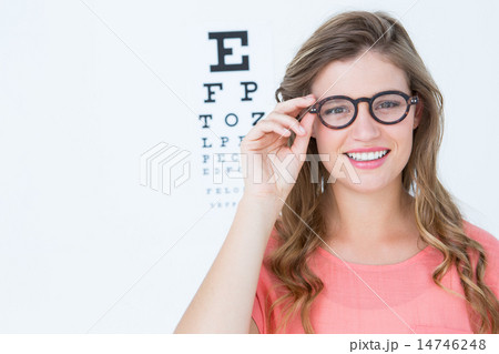 Pretty geeky hipster with glasses and eye test 14746248