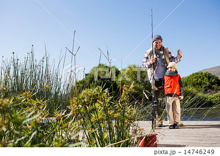 Happy man fishing with his son 14746249