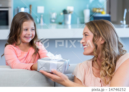 Daughter surprising mother with gift 14746252