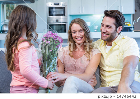 Daughter surprising mother with flowers Daughter surprising mother with flowers 14746442