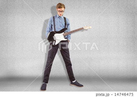 Composite image of geeky hipster playing the guitar Composite image of geeky hipster playing the guitar 14746475