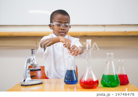 Cute pupil looking at liquids Cute pupil looking at liquids 14746476