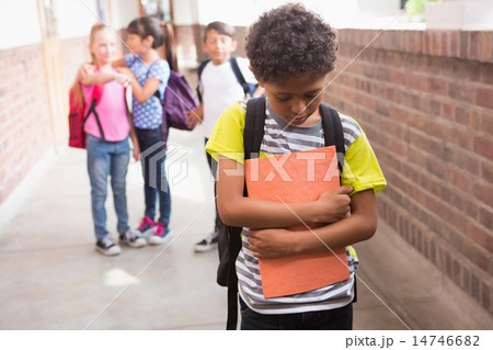 Pupils friends teasing a pupil alone Pupils friends teasing a pupil alone 14746682