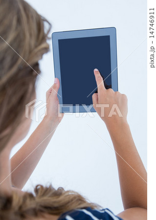 Woman using tablet pc Woman using tablet pc 14746911