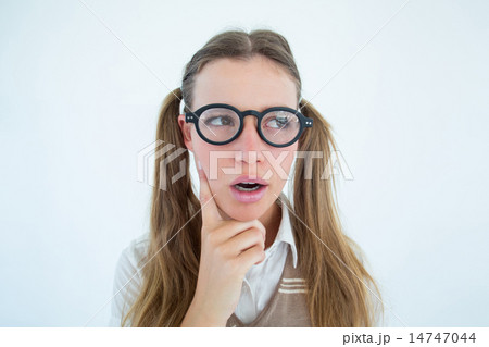 Female geeky hipster looking confused 14747044