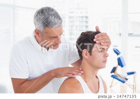 Doctor doing neck adjustment 14747135