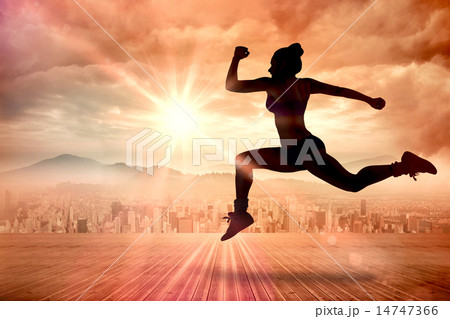 Composite image of fit brunette running and jumping 14747366