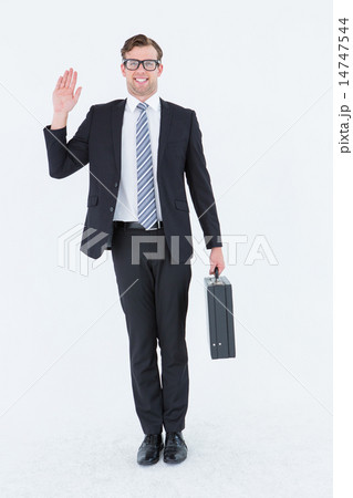 Geeky hipster businessman waving at camera Geeky hipster businessman waving at camera 14747544