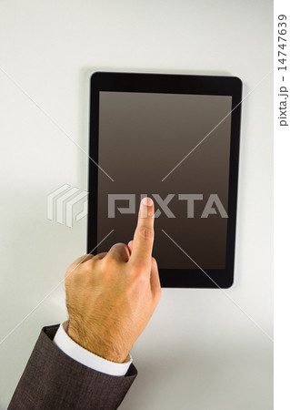 Man using his tablet pc Man using his tablet pc 14747639