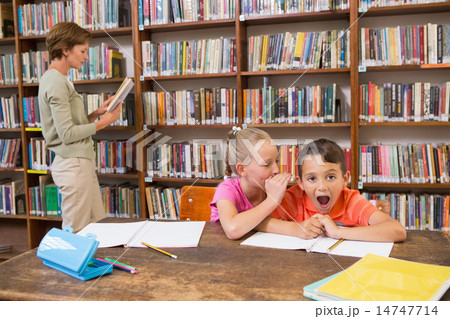 Cute pupils speaking at library Cute pupils speaking at library 14747714