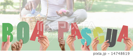 Composite image of hands holding up boa pasqua 14748619