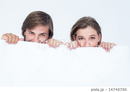 Hipster couple holding poster Hipster couple holding poster 14748780