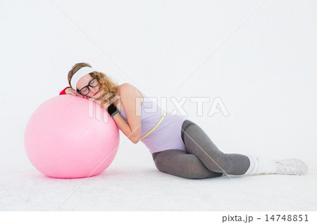 Geeky hipster resting on fitness ball 14748851