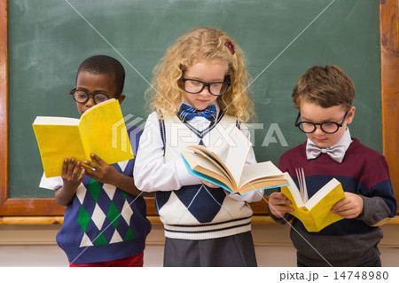 Pupils reading books Pupils reading books 14748980