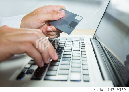 Man using laptop for online shopping 14749570