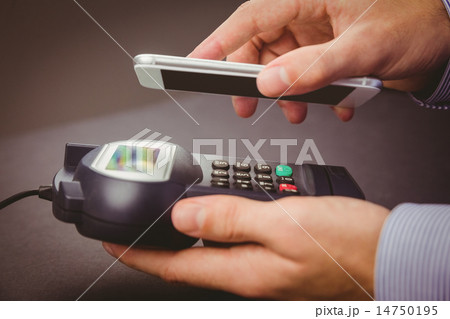 Man using smartphone to express pay Man using smartphone to express pay 14750195