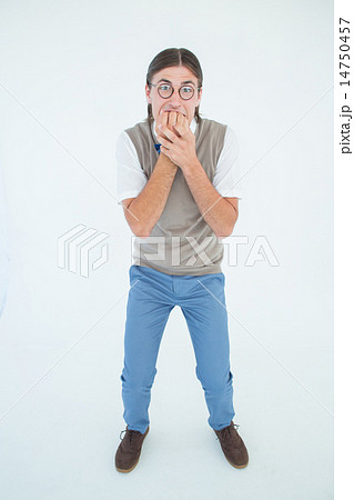 Geeky hipster looking nervously at camera 14750457