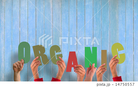 Composite image of hands holding up organic Composite image of hands holding up organic 14750557