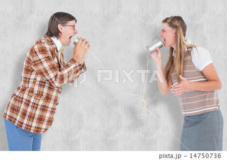 Composite image of geeky hipsters using string phone 14750736