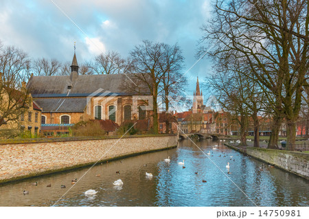 Lake Minnewater and church in Bruges, Belgium Lake Minnewater and church in Bruges, Belgium 14750981